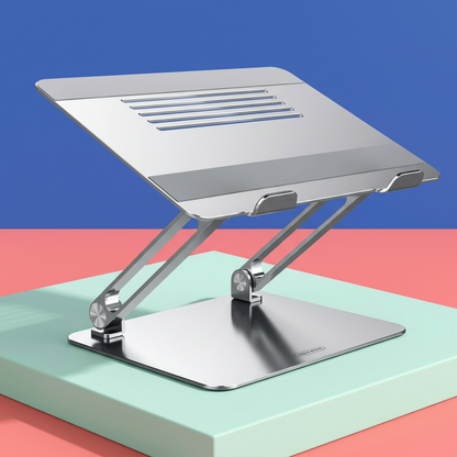 Silver Nuvwllia laptop stand on a colorful studio platform