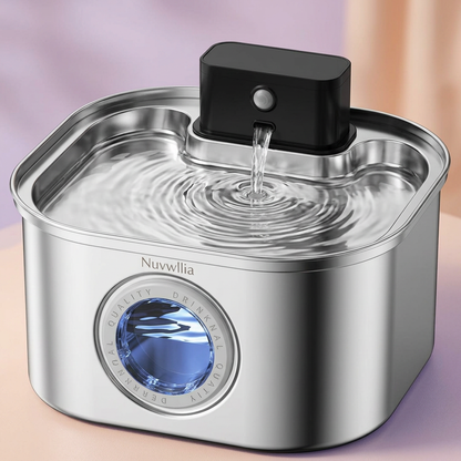 Close-up of fountain spout stream and ripples in the drinking tray